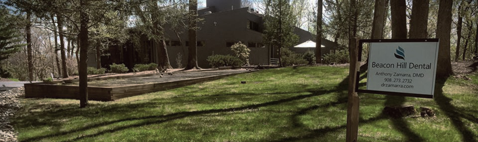 The image shows a sign in front of a building with the text  Seasonal Dental  visible, indicating that this location is associated with dental care services.