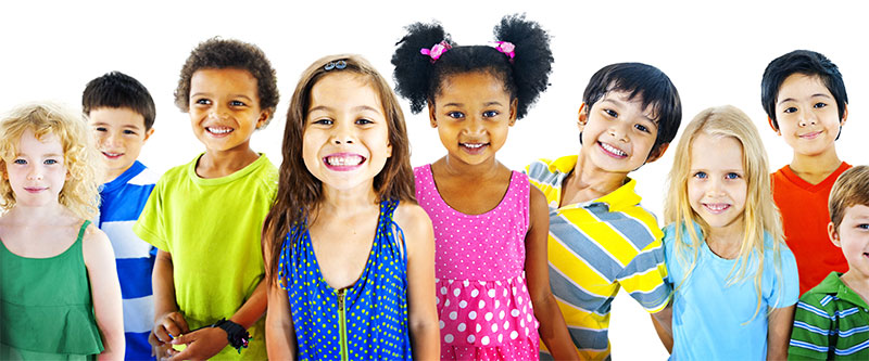 A group of diverse children posing for a photo with bright colors in their attire.